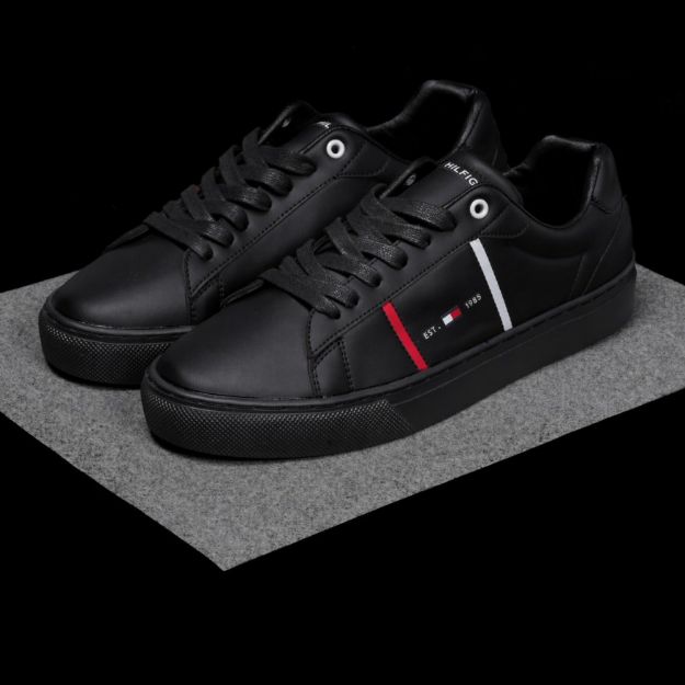 Picture of Black sneakers with a red side stripe
